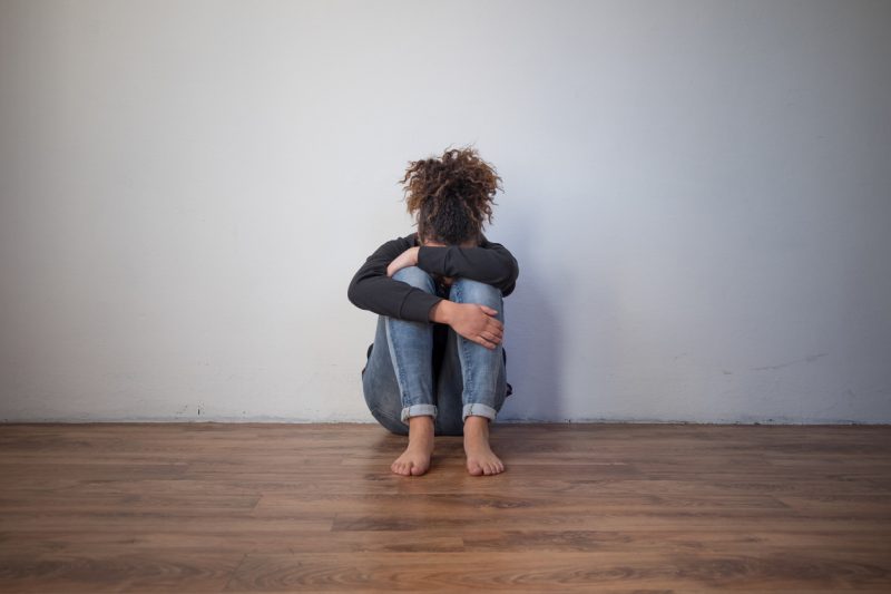 Treating Childhood Trauma | Sad and lonely black girl feeling depressed